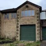 a couple bought a derelict land rover dealership for 330000 and turned it into a five bedroom home the forecourt can fit around 50 cars
