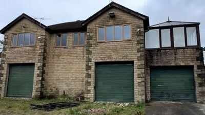 a couple bought a derelict land rover dealership for 330000 and turned it into a five bedroom home the forecourt can fit around 50 cars