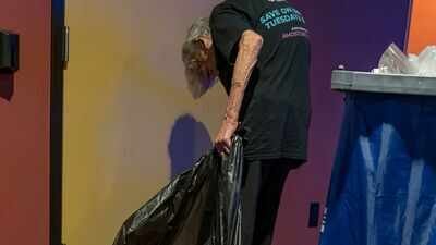 brooklyn green spotted an elderly worker emptying rubbish at an amc theatre in tennessee and recorded a video of her