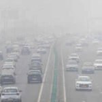 file photo traffic moves along a highway amidst air pollution in new delhi india