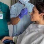 nushrratt bharuccha shares first video from hospital as she recovers from spine injury medical staff feed her meal while gerua plays on tv dreaming endlessly