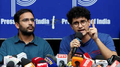 saurav das chief spokesperson of the cockroach janta party cjp speaks next to ashutosh ranka co convenner of cjp during a press conference at the press club of india following their release