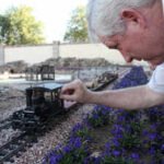 sirrine had been interested in model railways from a long time photo all about mesa az image enhanced by ai