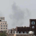 smoke rises after reports of an airstrike hitting near the sanaa international airport
